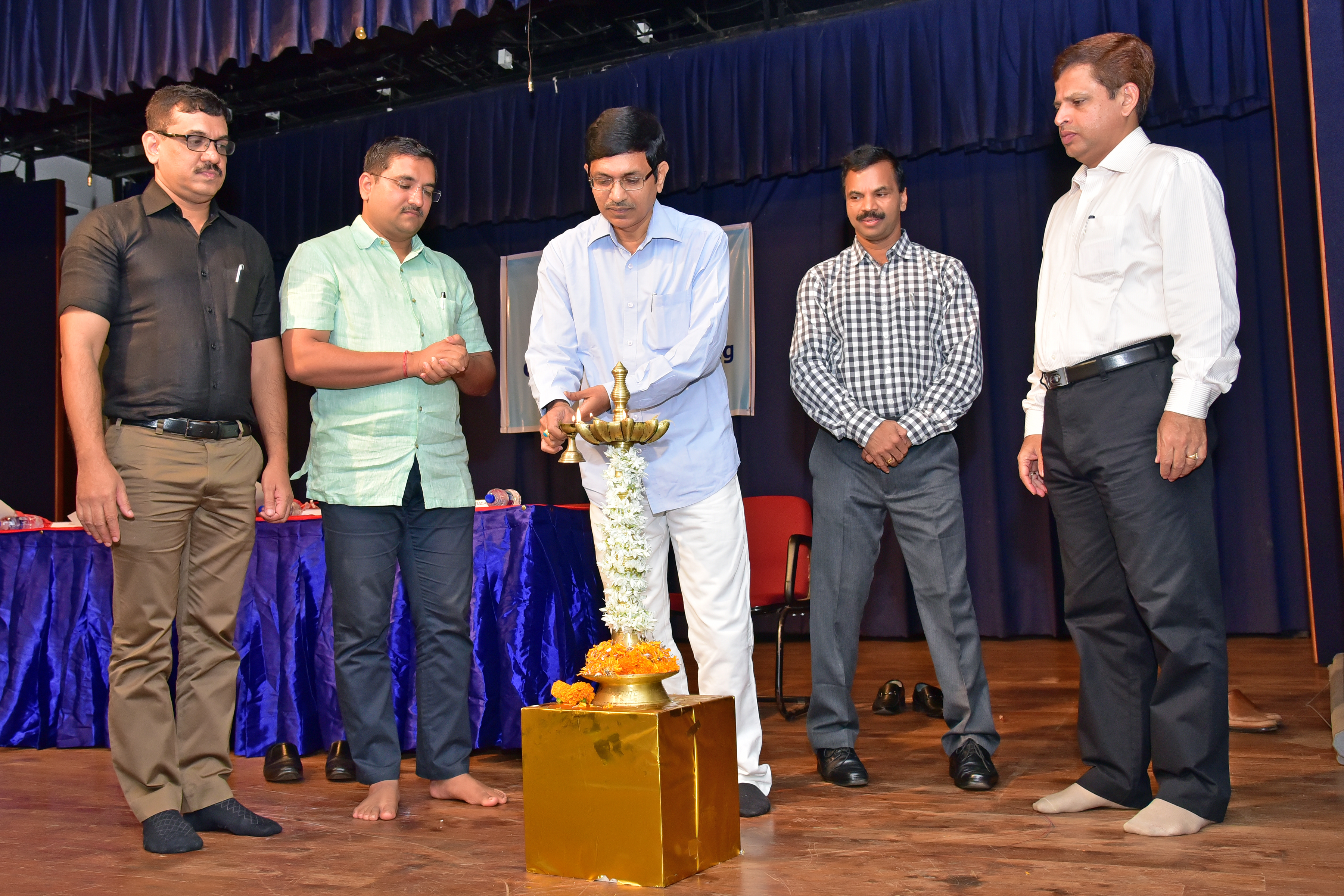 Photo of Commercial Department Officials lighting the diva.